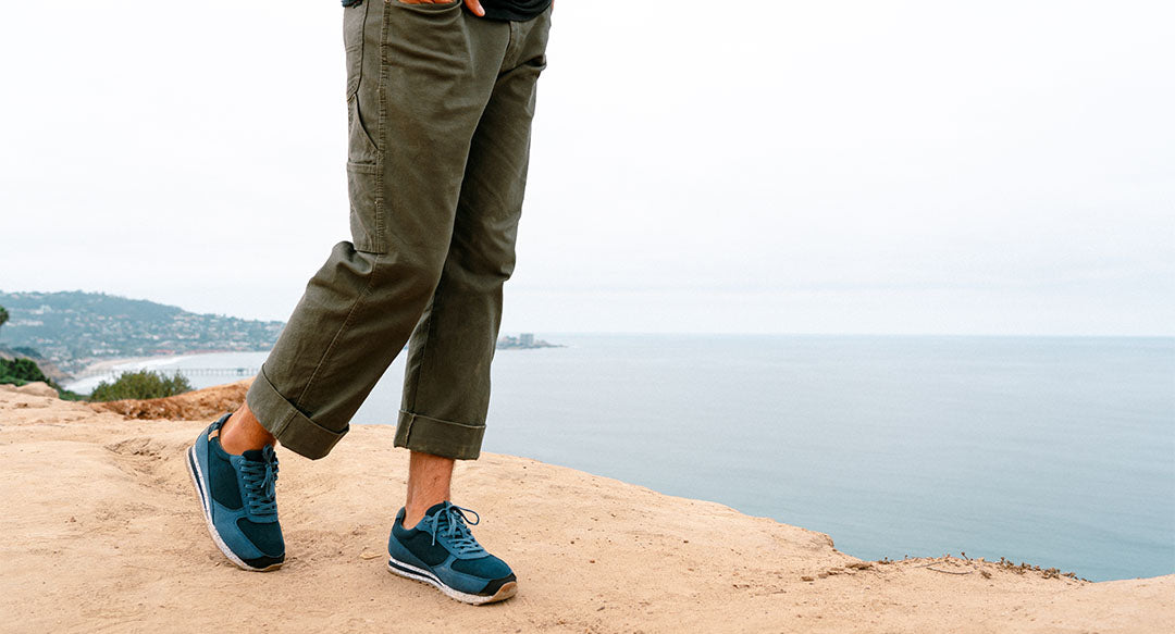Men's shoes in blue color worn from the front