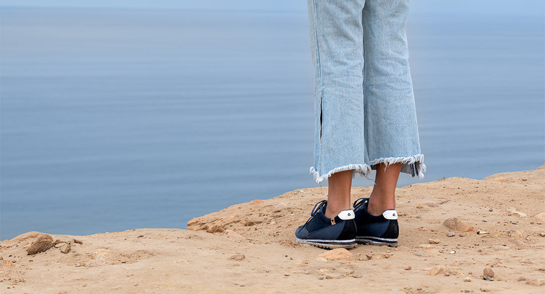 Blue woman shoes worn and seen from behind