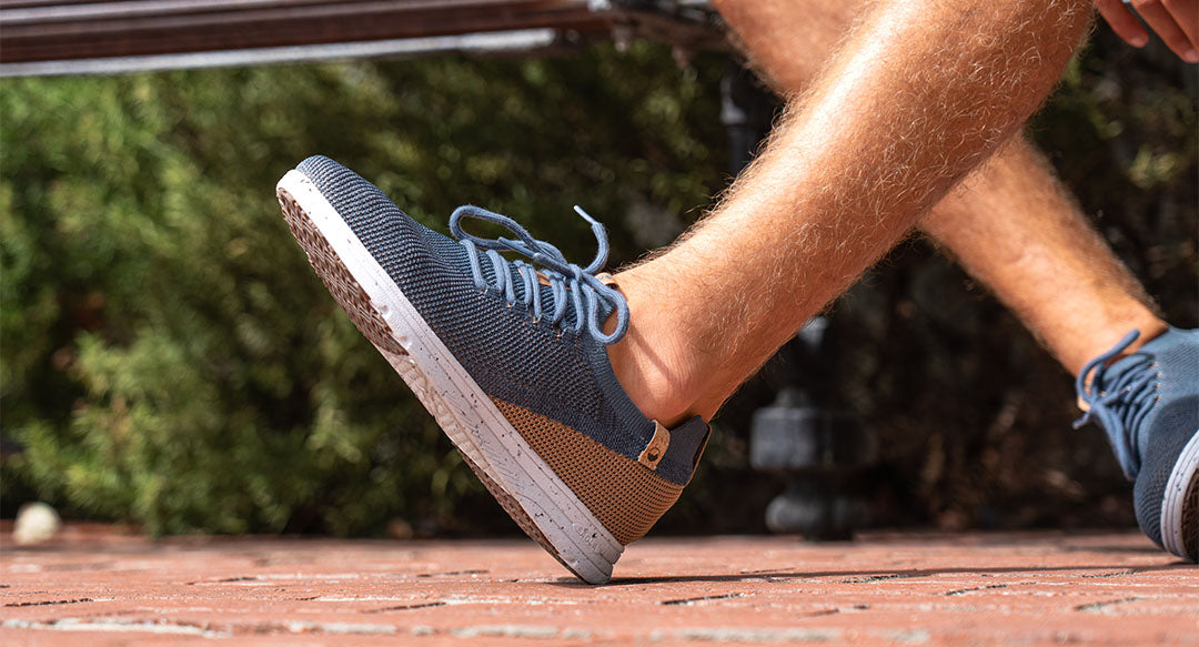 men's navy shoes worn from left side