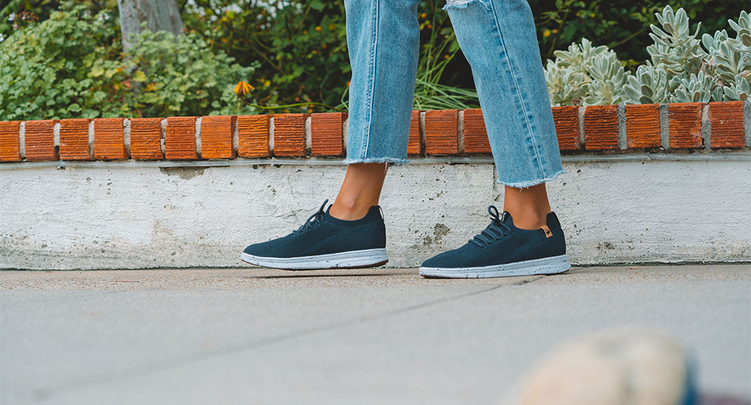 women's navy shoes worn from left side