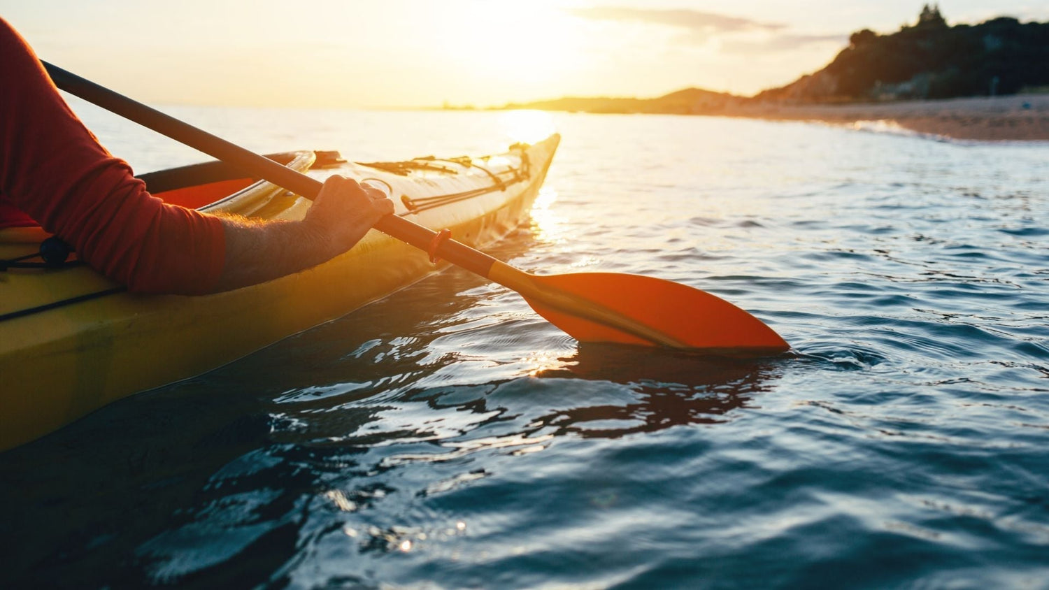 person kayaking in a lake